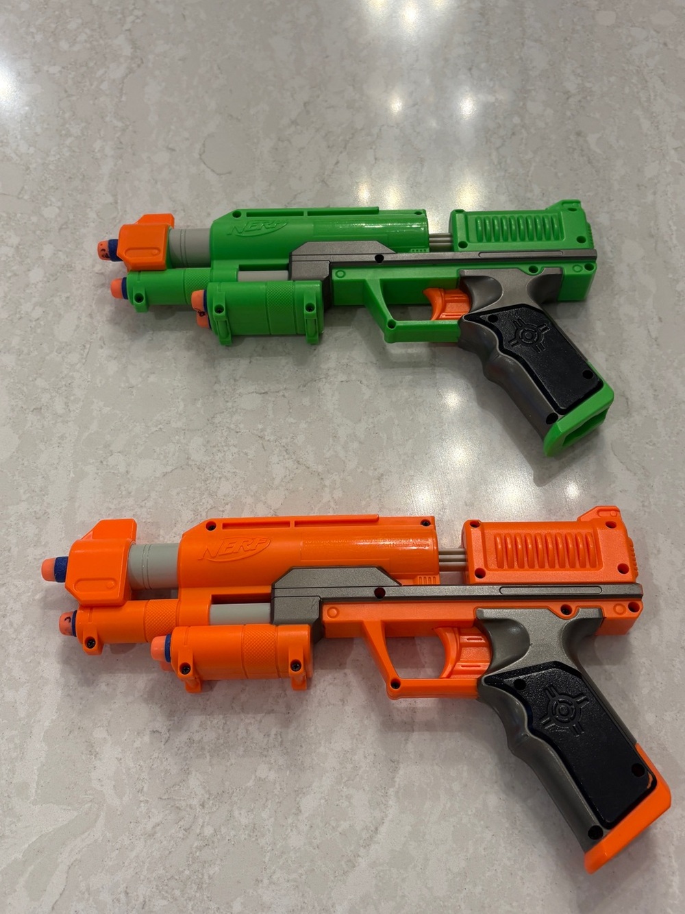 Nerf Dual Toy Blasters in Bright Orange and Neon Green
